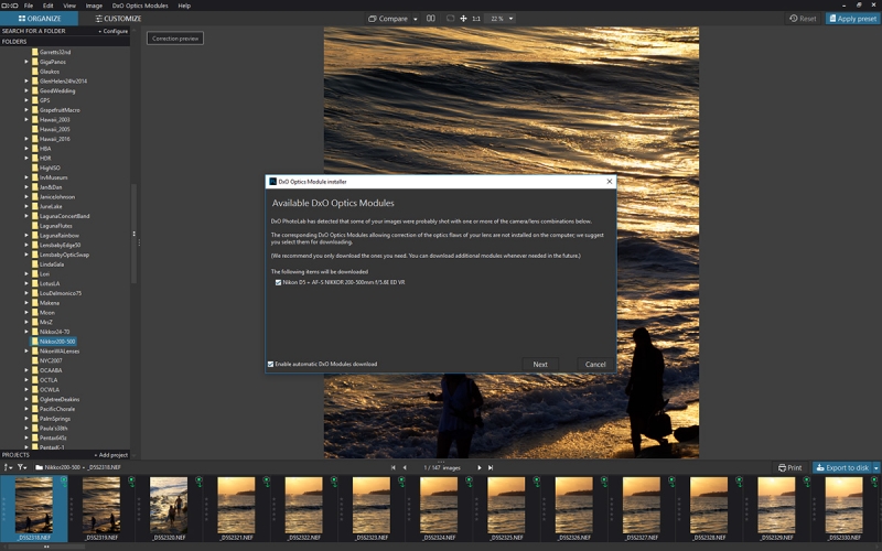 PhotoLab prompts you to download camera/lens modules for automatic adjustments.