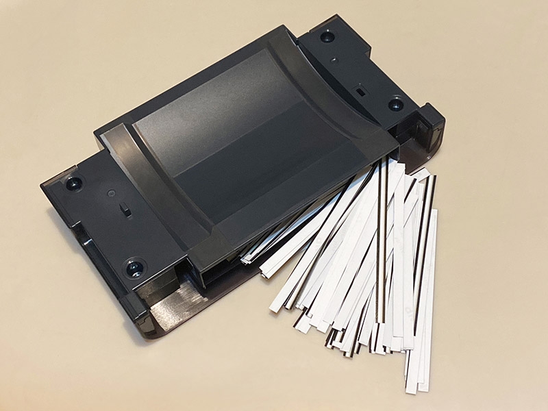 The QW410's paper scrap bin, which stores thin pieces of paper as the printer operates. It looks like you could print close to a thousand prints before the bin would be completely full.