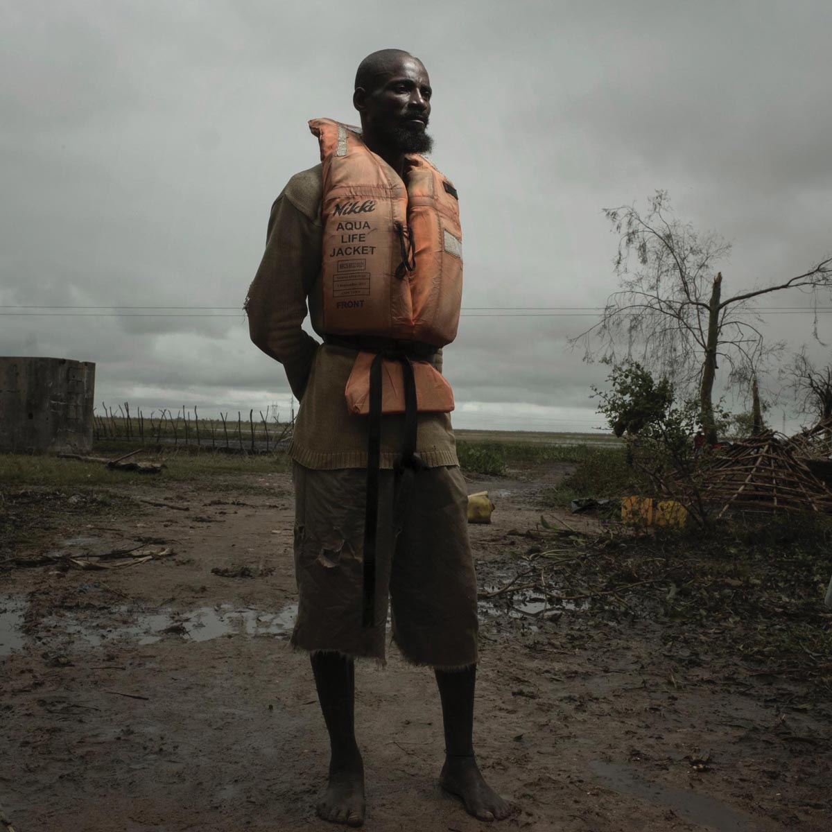 man wearing orange life jacket during flooding rescue in Mozambique