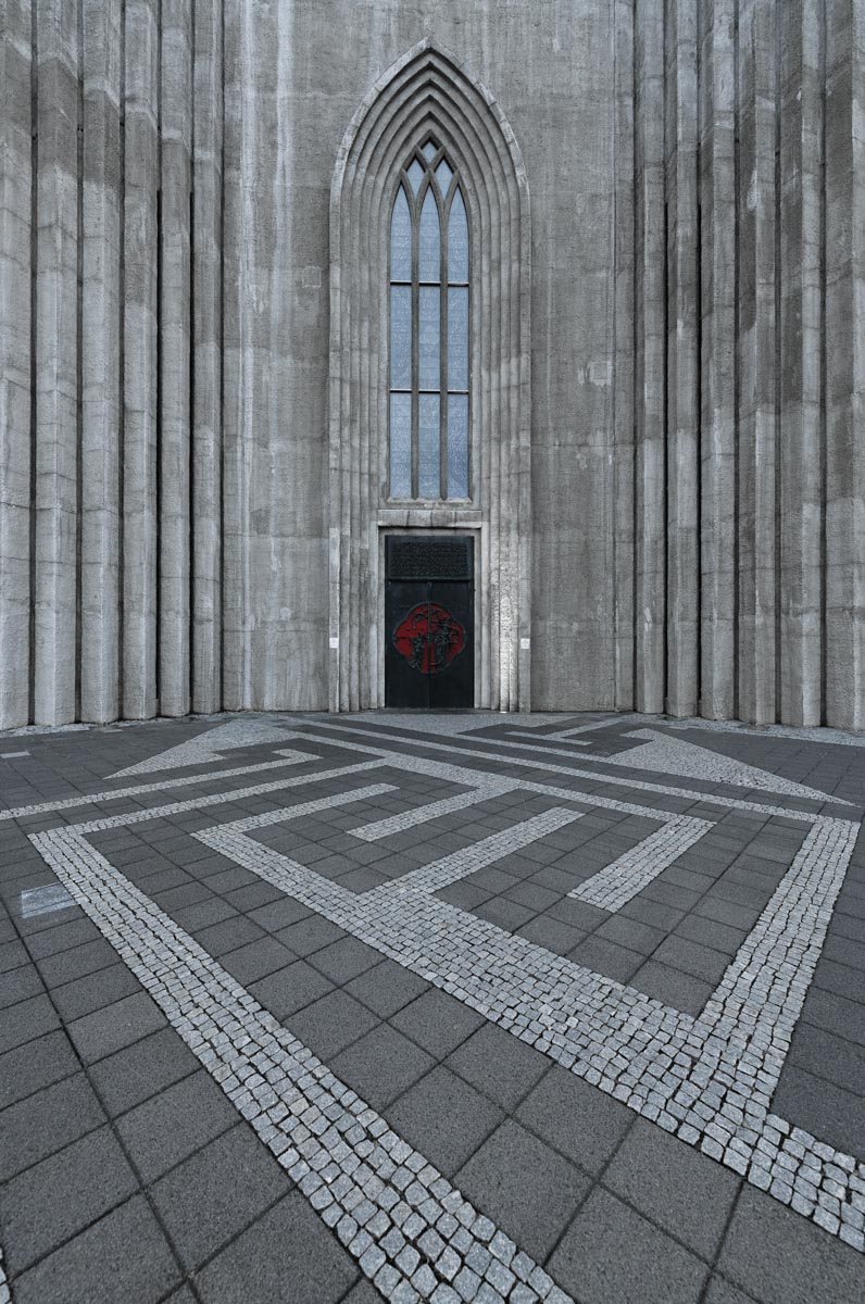door to stone church with stone walkway
