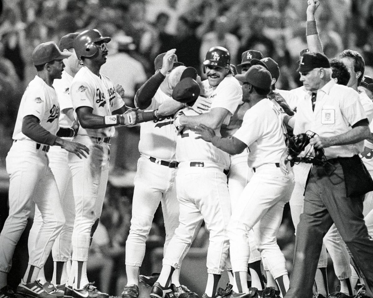 Dodgers Kirk Gibson celebrating with players in 1988 World Series after walk-off home run