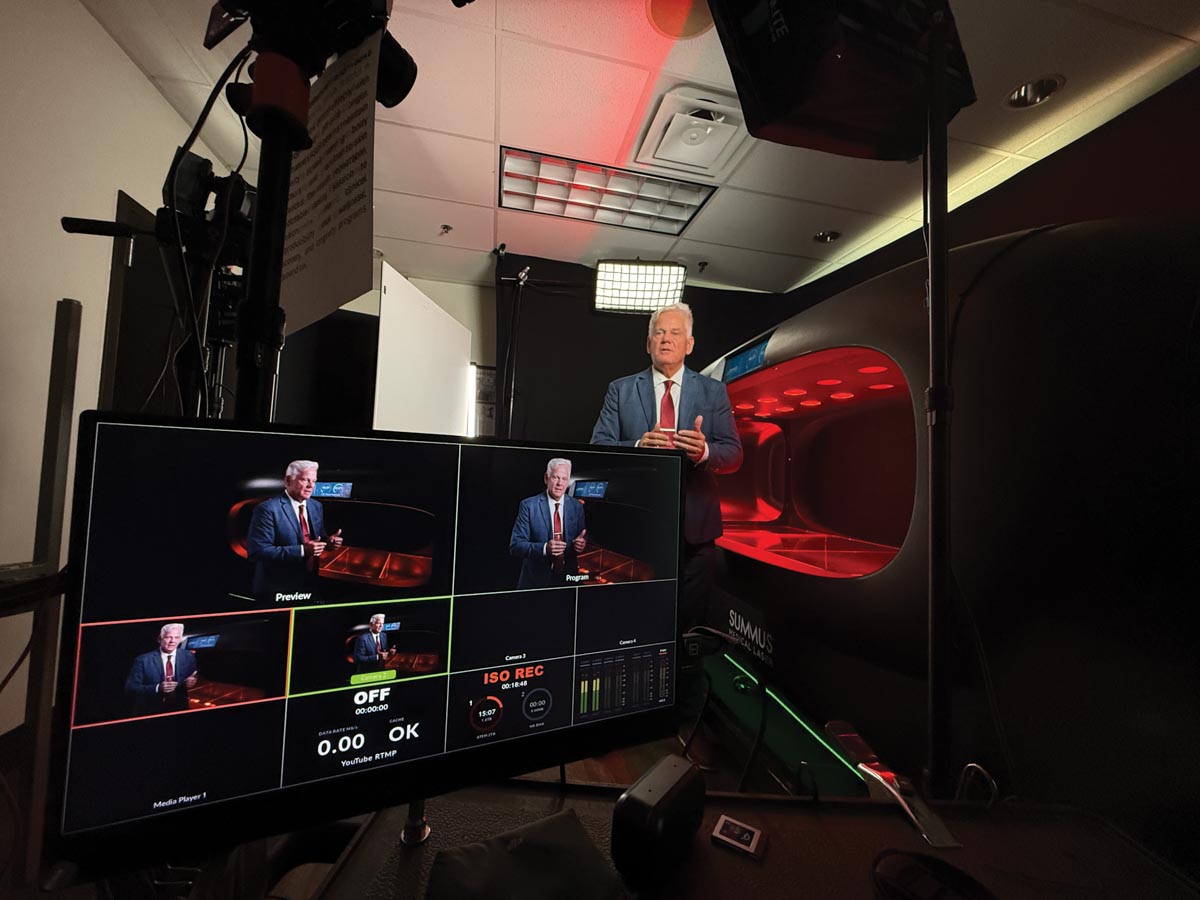 photo of a film set with screen showing what's on camera