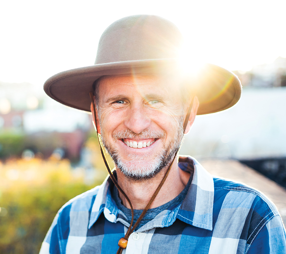 Photographer Chris Orwig in a tan felt hat and blue checked shirt