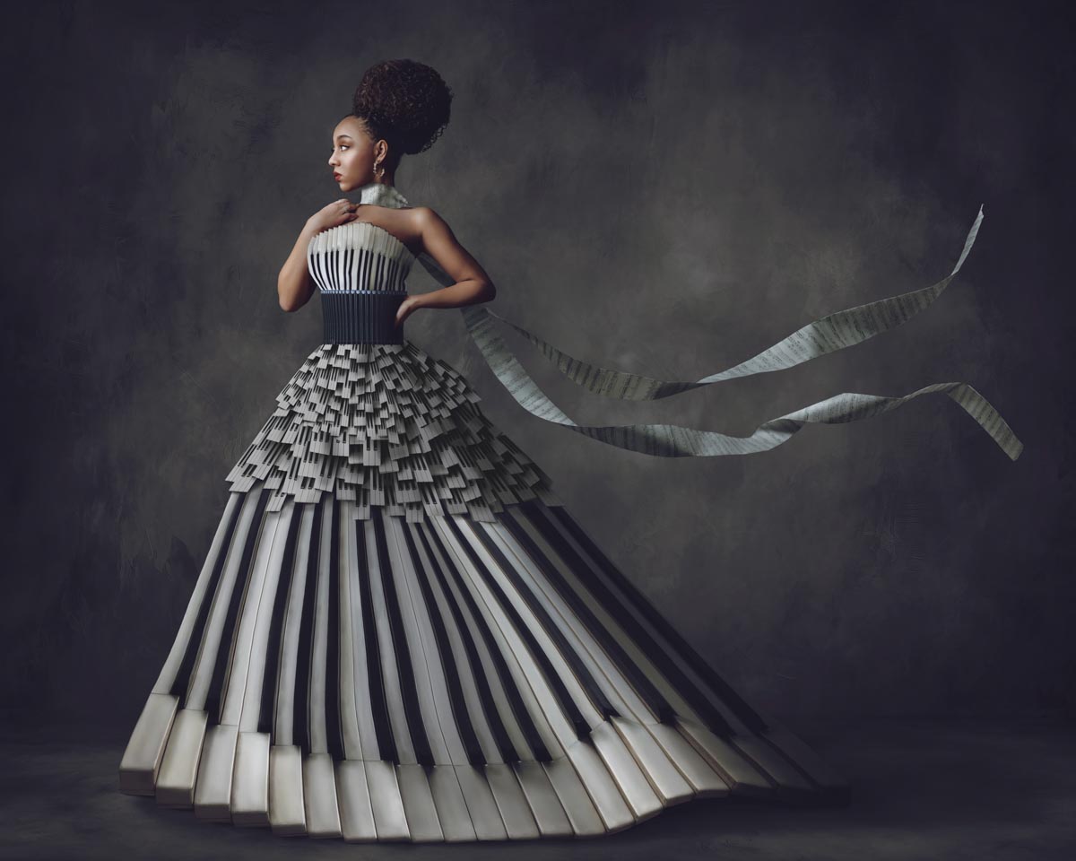 portrait of a girl wearing a dress that looks like it's made of piano keys
