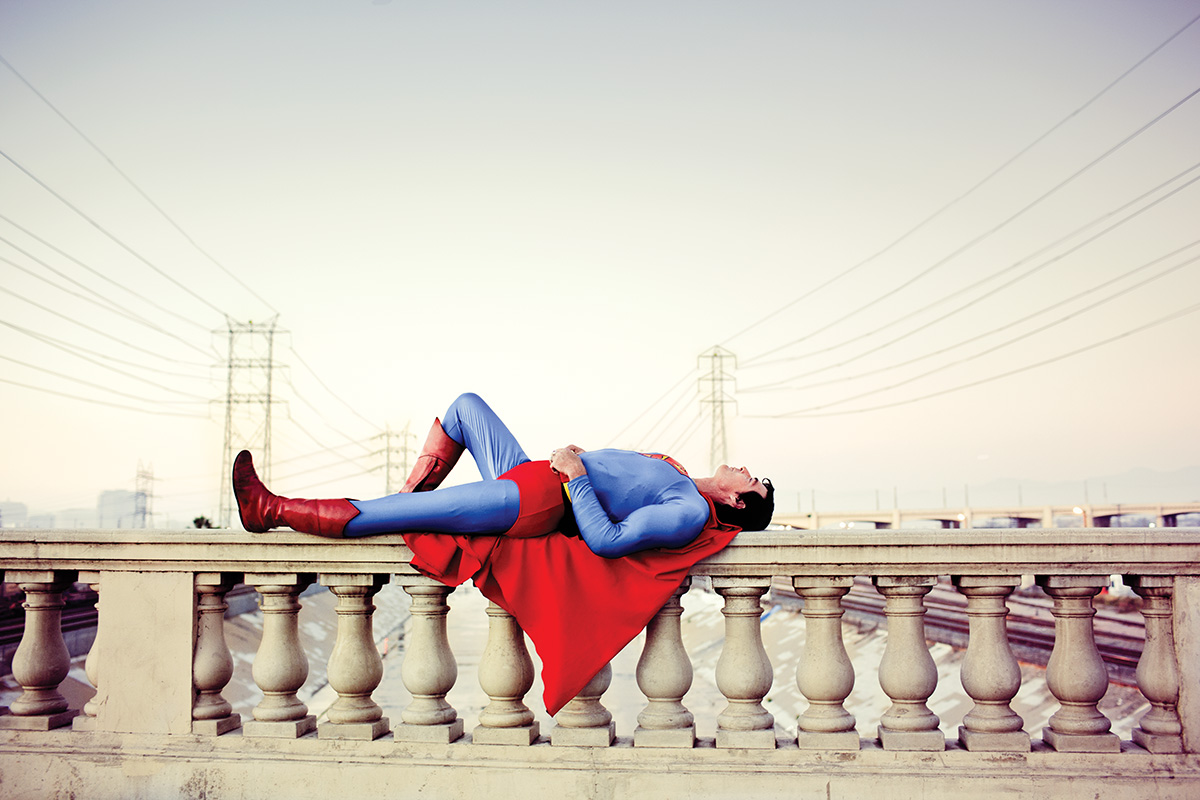 Superman lying on a ledge
